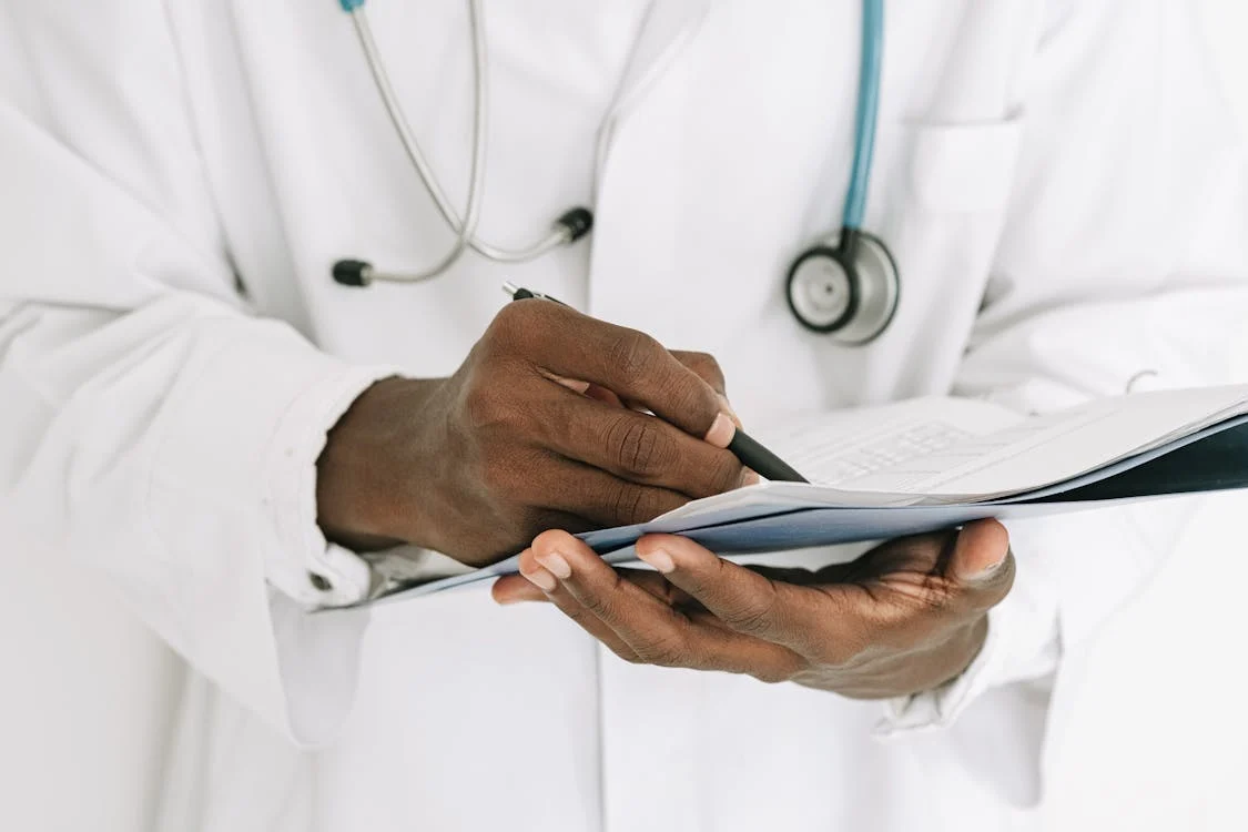 doctor writing a medical record