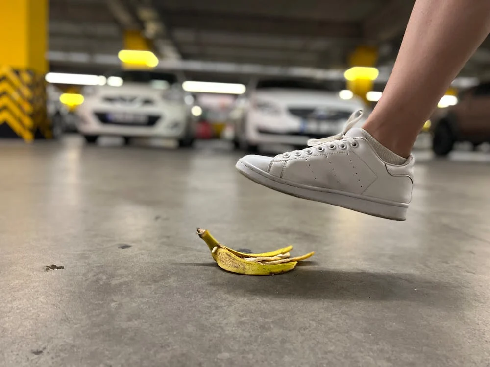 person stepping on banana