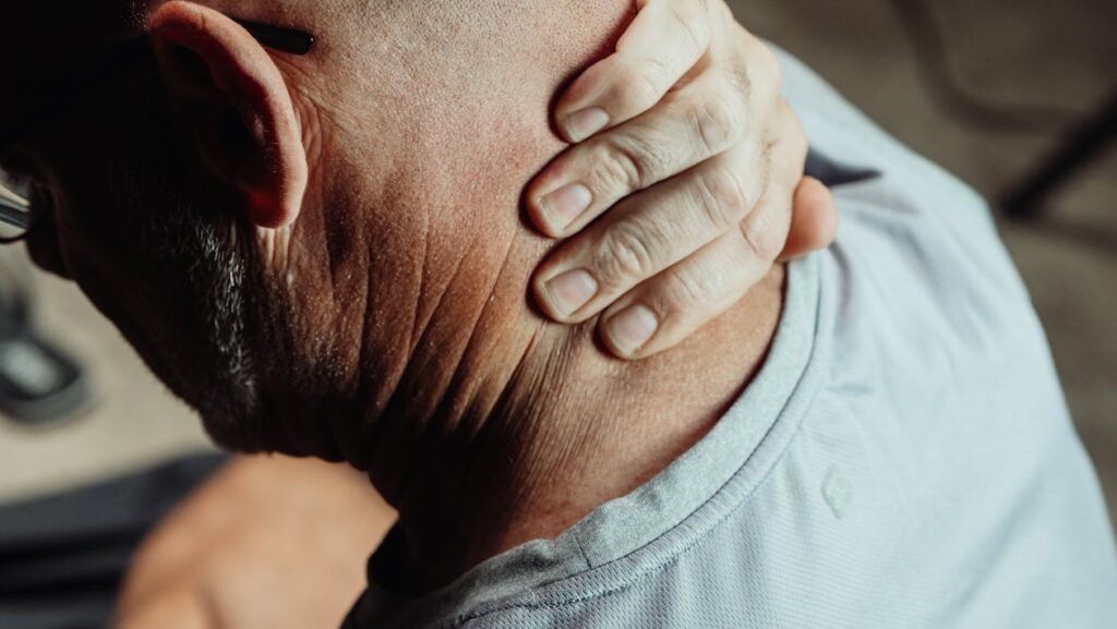 man having neck pain