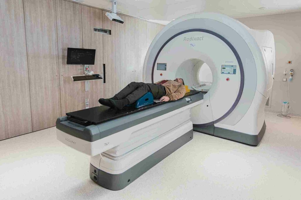 A man in a CT scan machine