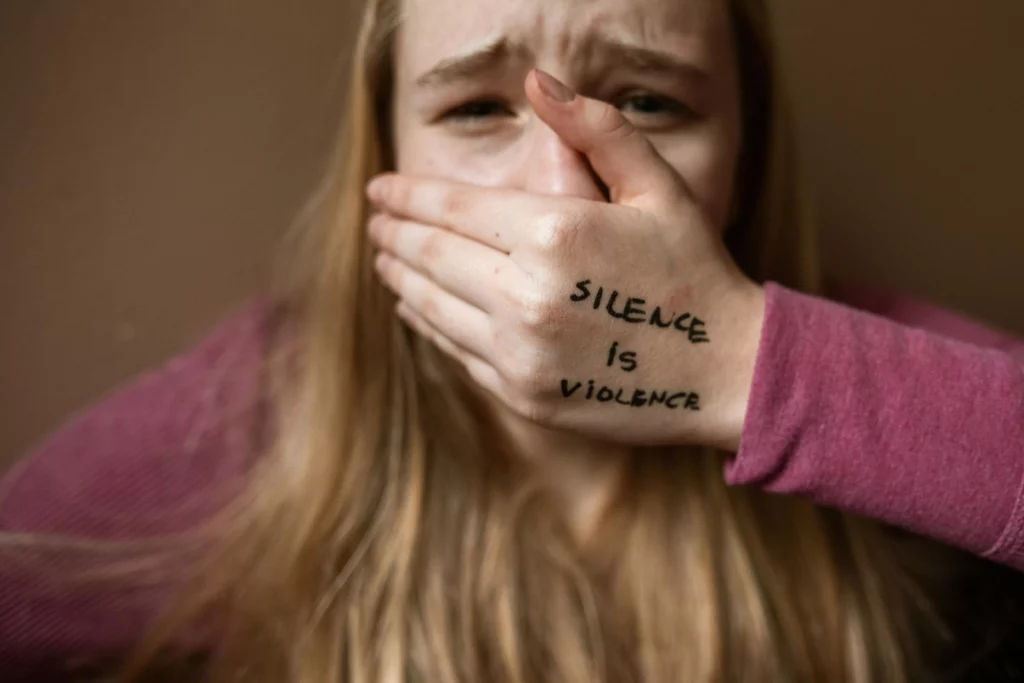 woman covering her mouth