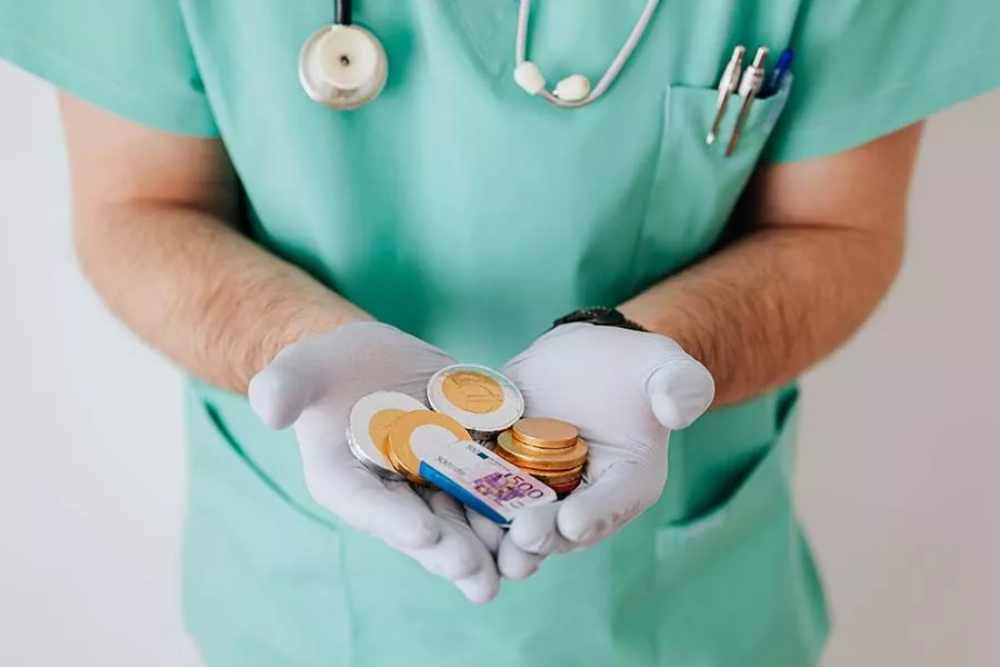doctor holding play money