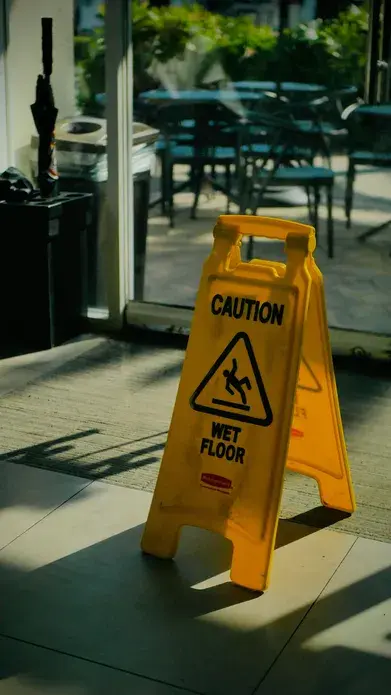 yellow wet floor sign in a store