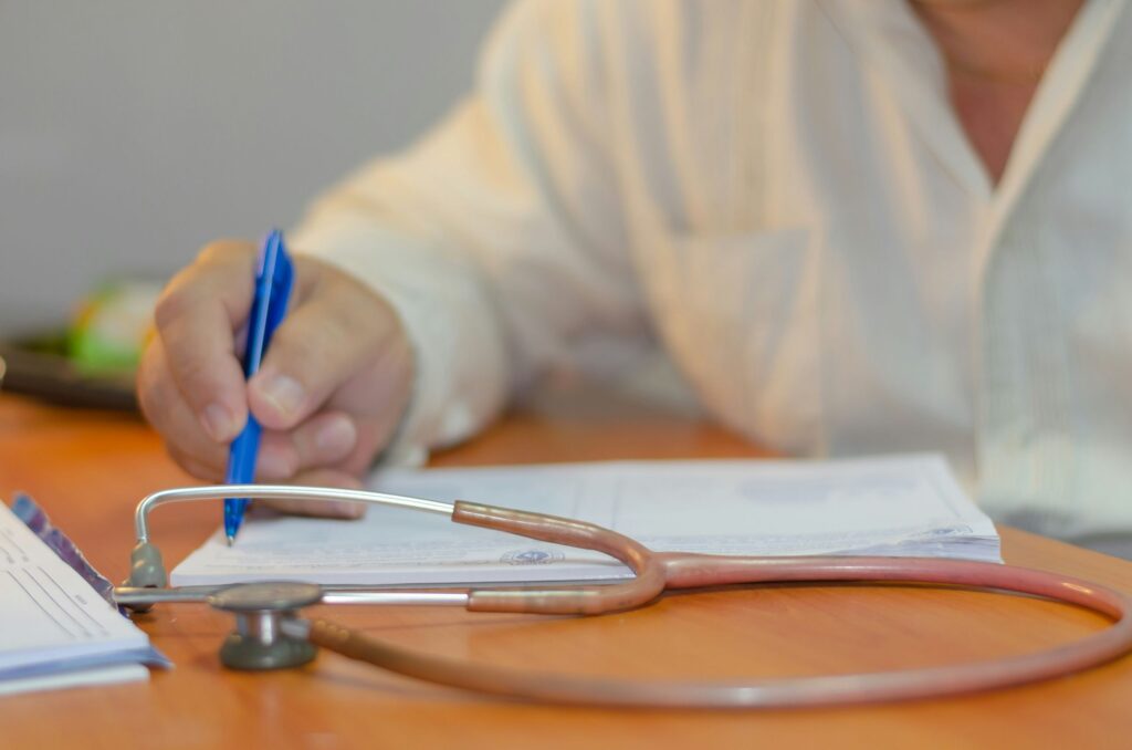 doctor writing a medical record