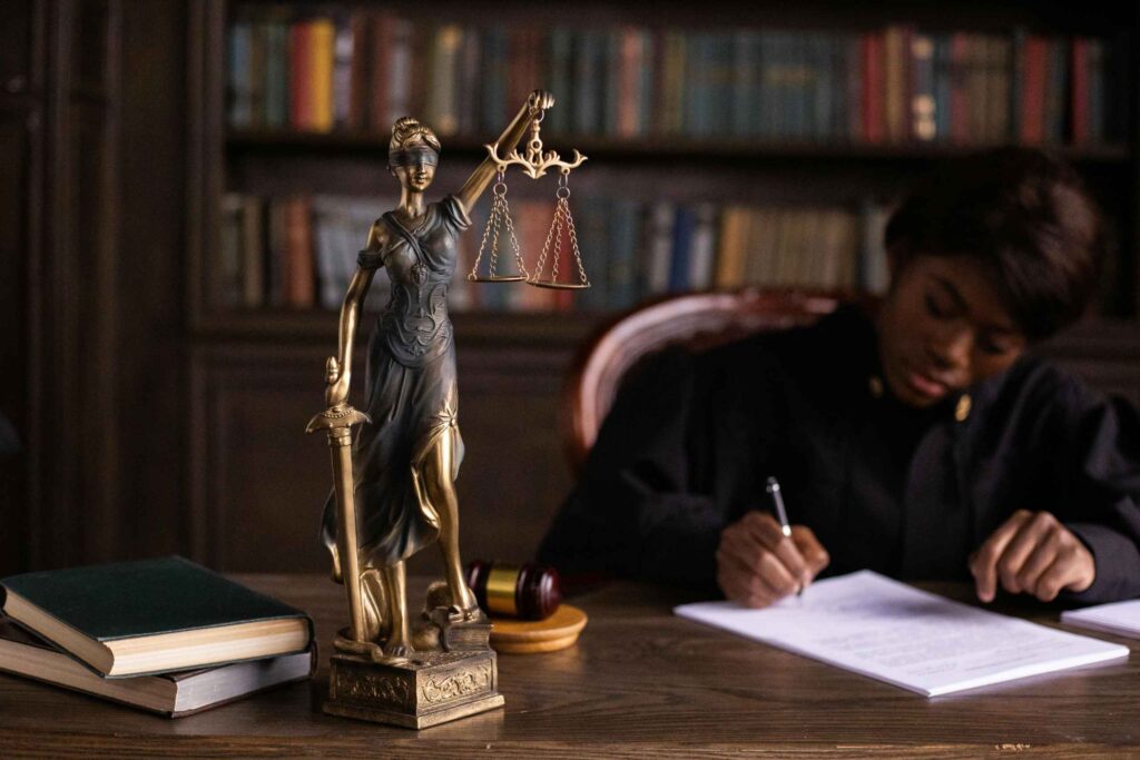 lady justice figurine on top of a judge's table