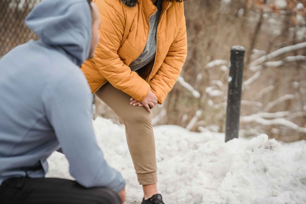 person holding on to their knee