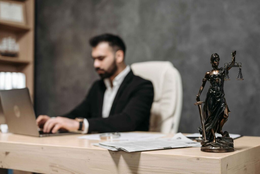 lady justice figurine on top of an attorney's table