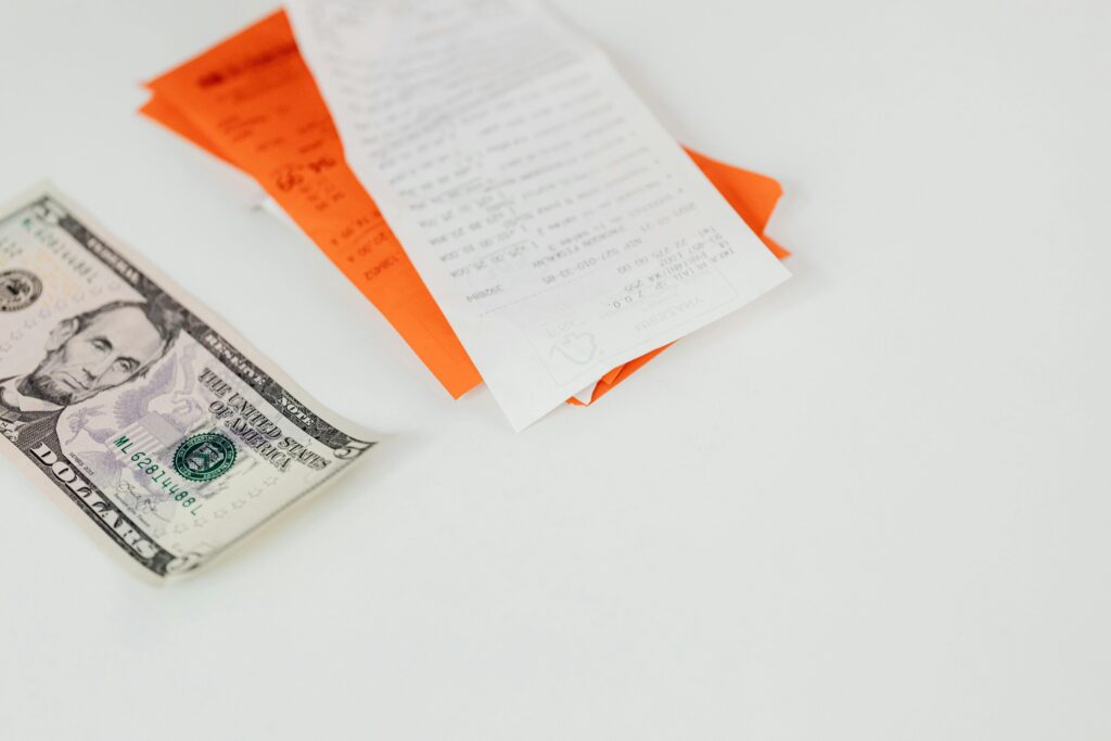 dollar bill and medicine receipt