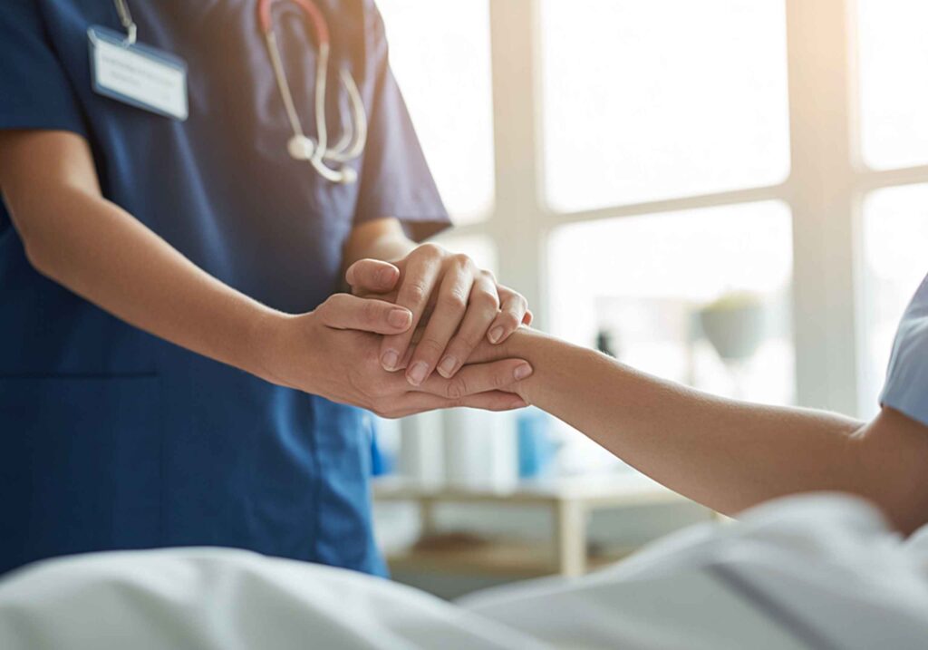 nurse holding patient's hand