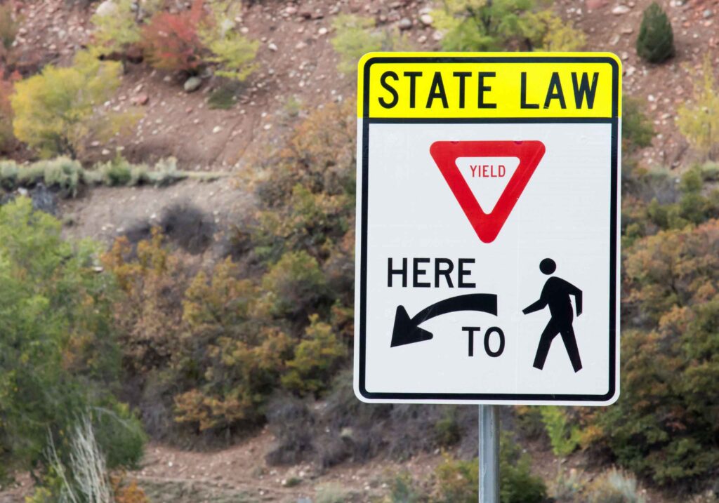 yield for pedestrian road sign