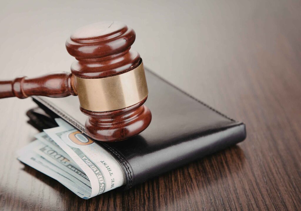 gavel on wallet with money