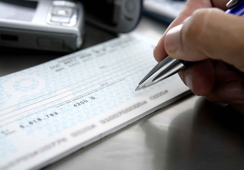someone signing a check