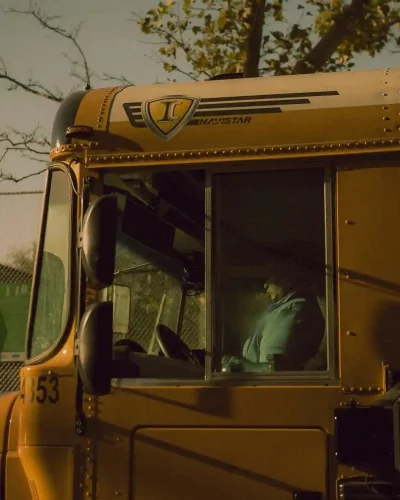 driver in a yellow bus